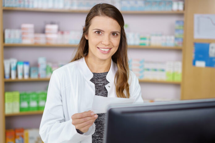 Pharmacy technician entering prescription order