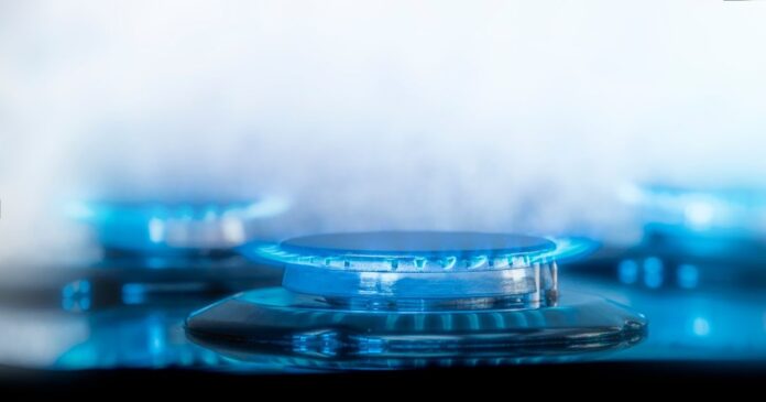Gas,Flame,On,A,Gas,Stove,Against,A,White,Background