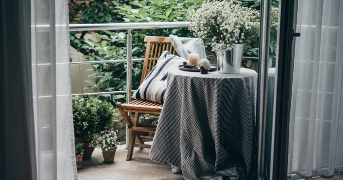 Beautiful,Terrace,Or,Balcony,With,Small,Table,,Chair,And,Flowers