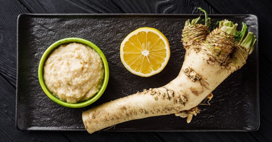 Aromatic,Horseradish,Root,On,A,Black,Rustic,Wooden,Background.