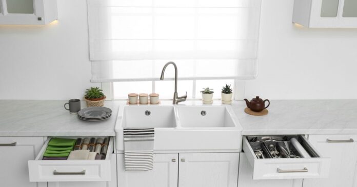 Open,Drawers,With,Different,Utensils,,Towels,And,Napkins,In,Kitchen